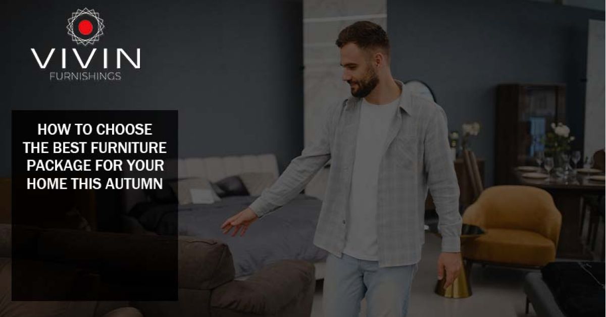 Man selecting a sofa in a modern furniture showroom, illustrating how to choose the best furniture package for a home in autumn